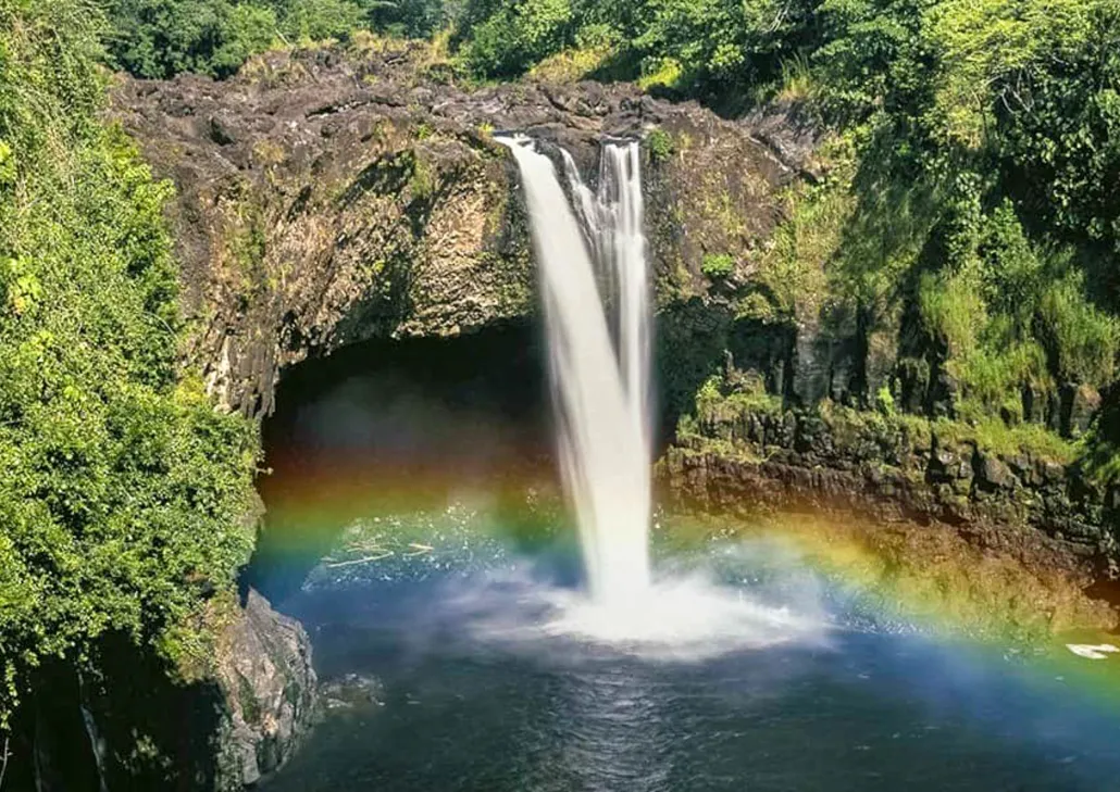 Rainbow Falls pouring over its lava cave, one of the main waterfalls to see in Hilo Hawaii