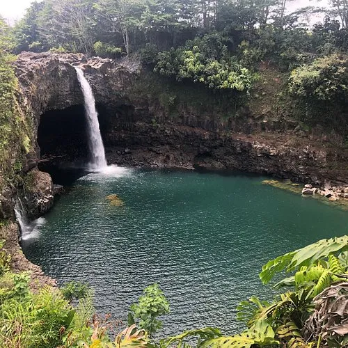 The wide green plunge pool of the Wailuku River below Rainbow Falls, a quieter hilo waterfall photo spot for a longer exposure
